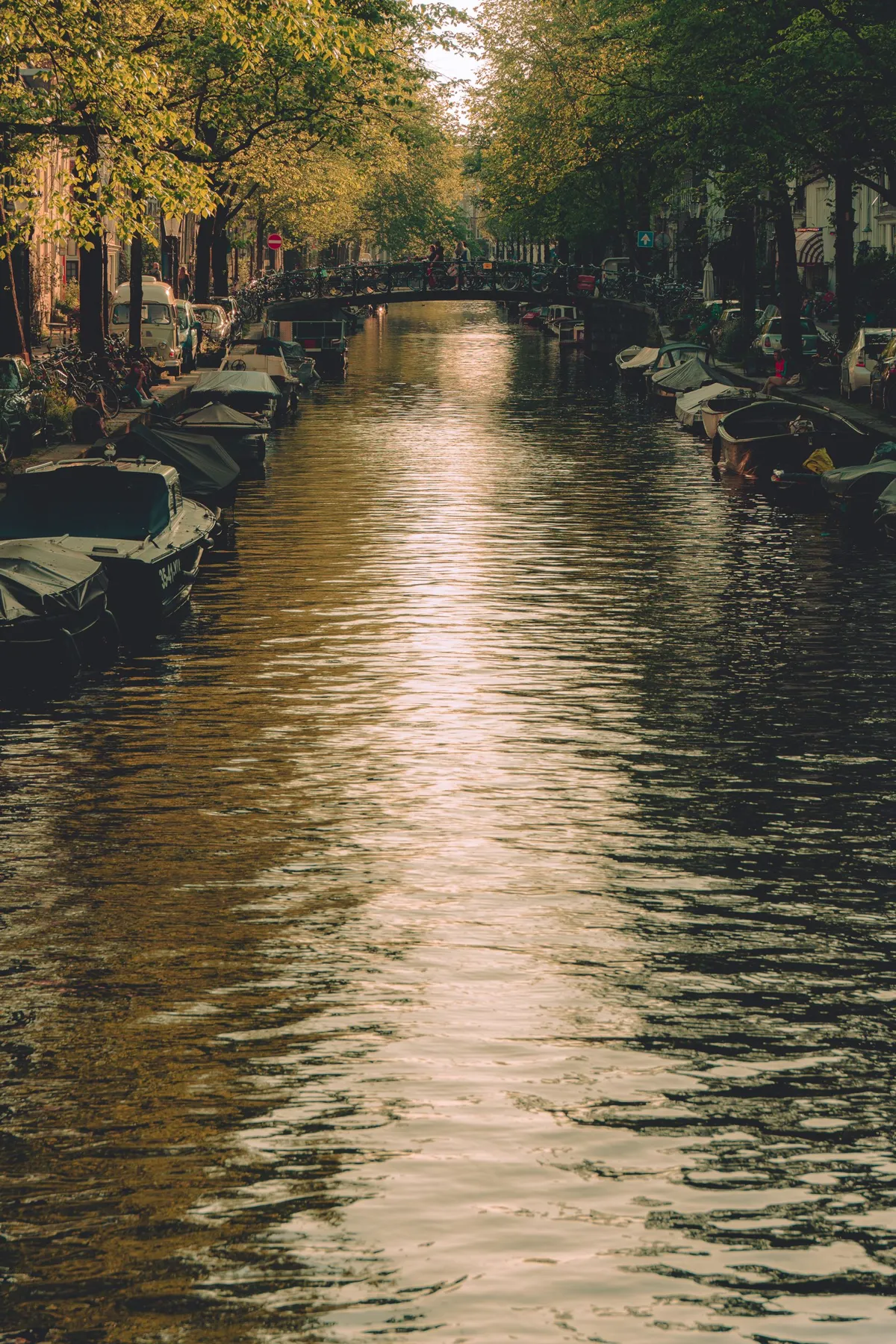 Amsterdam canal with boats and historic buildings