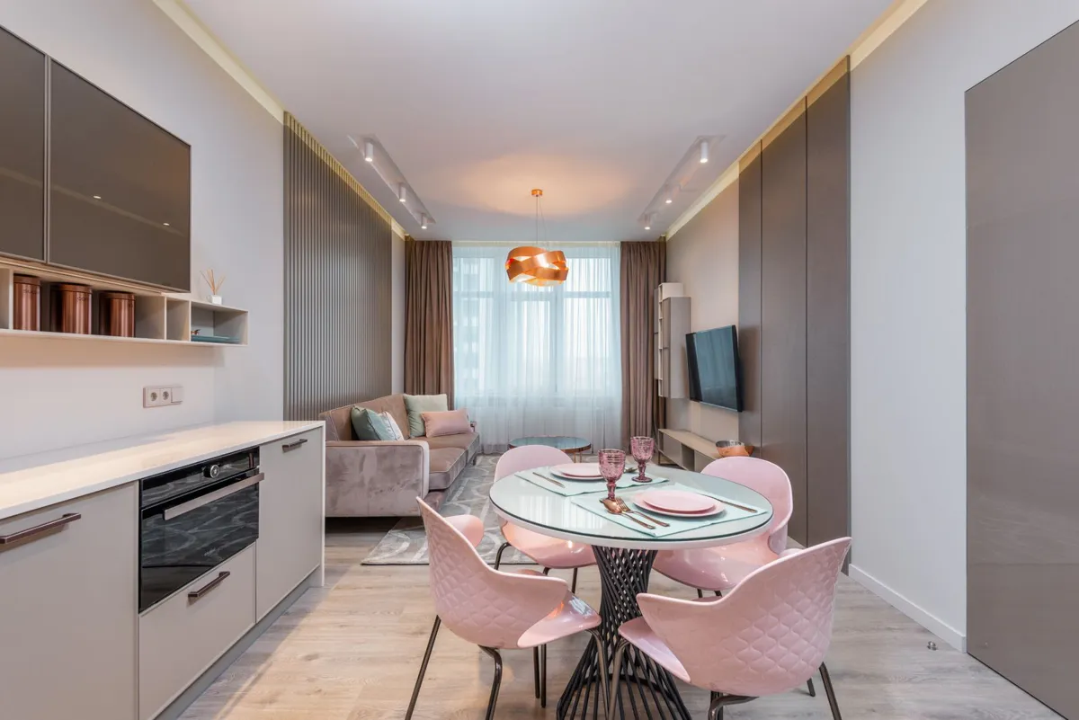 Apartment kitchen beside a dining area