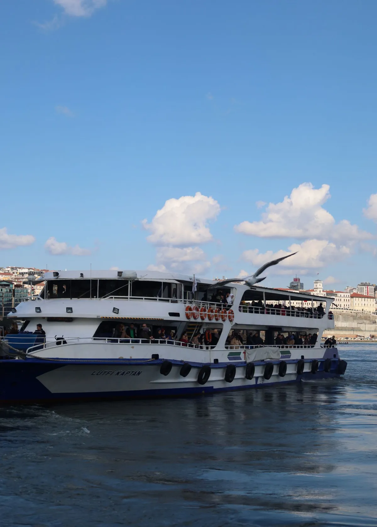 Passenger ferry traveling along a city river