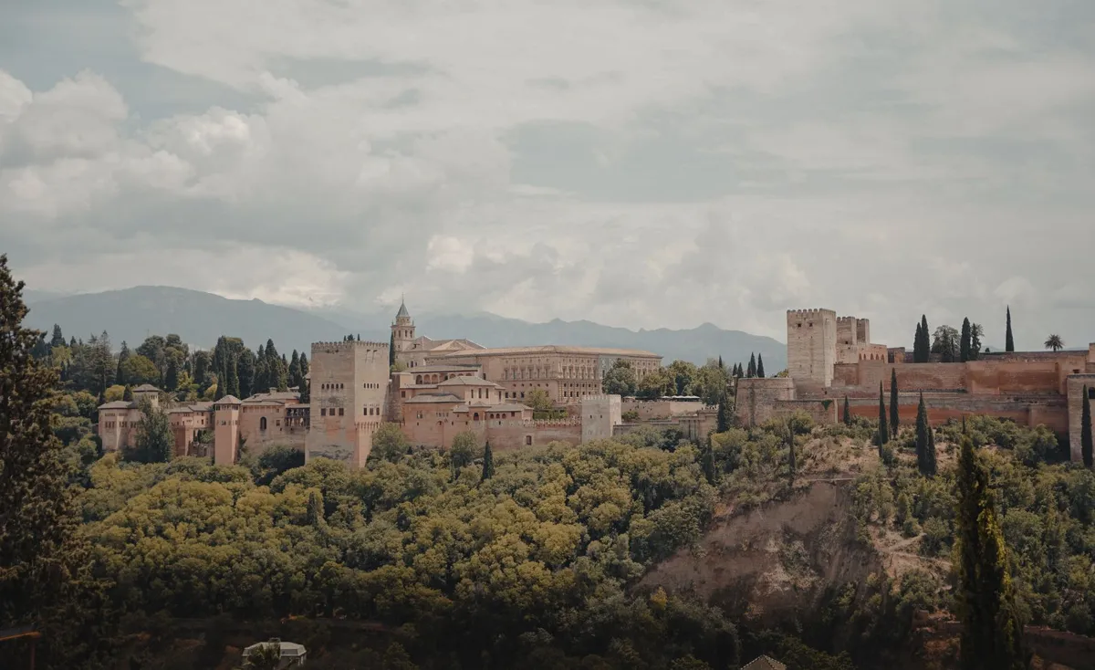 The Alhambra above Granada amid green hills