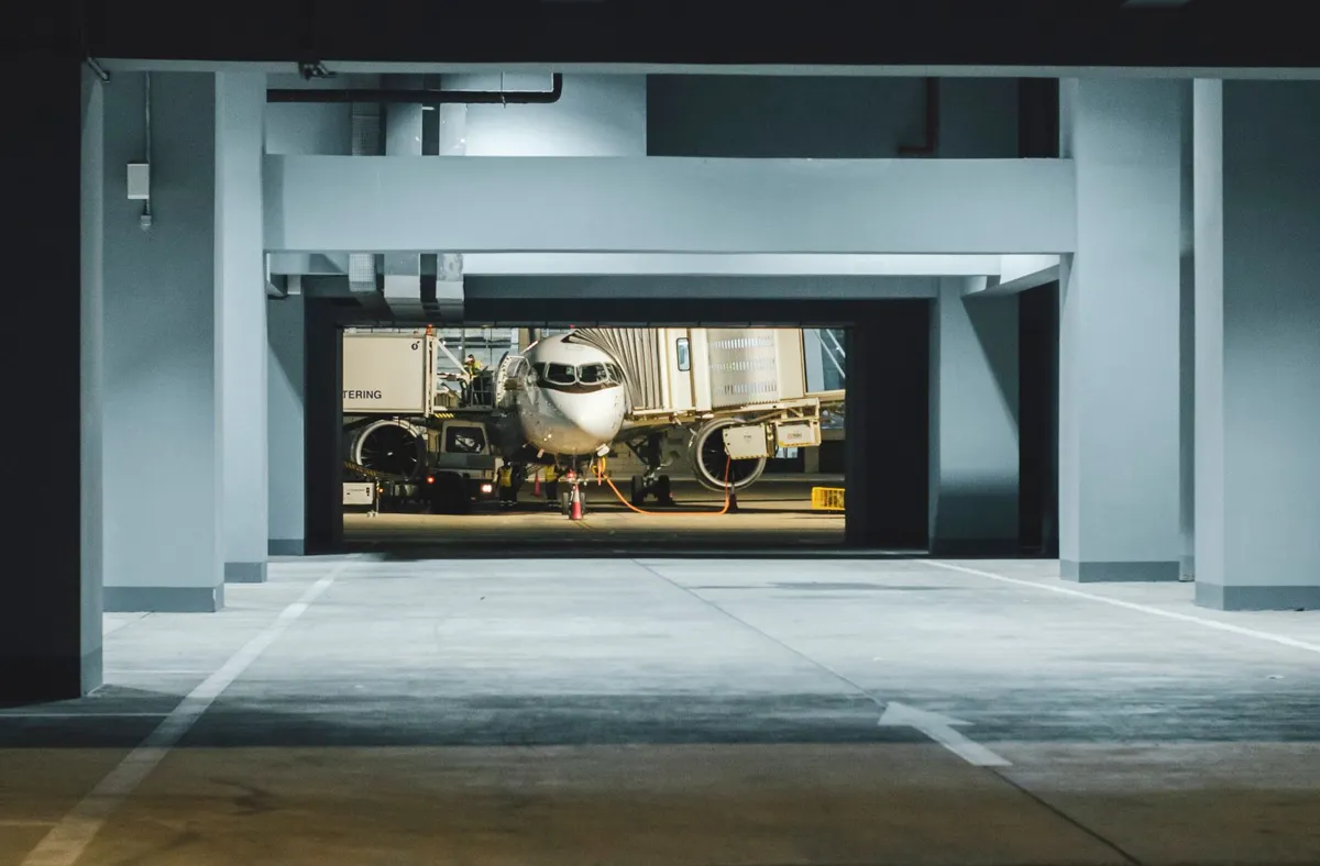 Aircraft at an airport terminal after dark