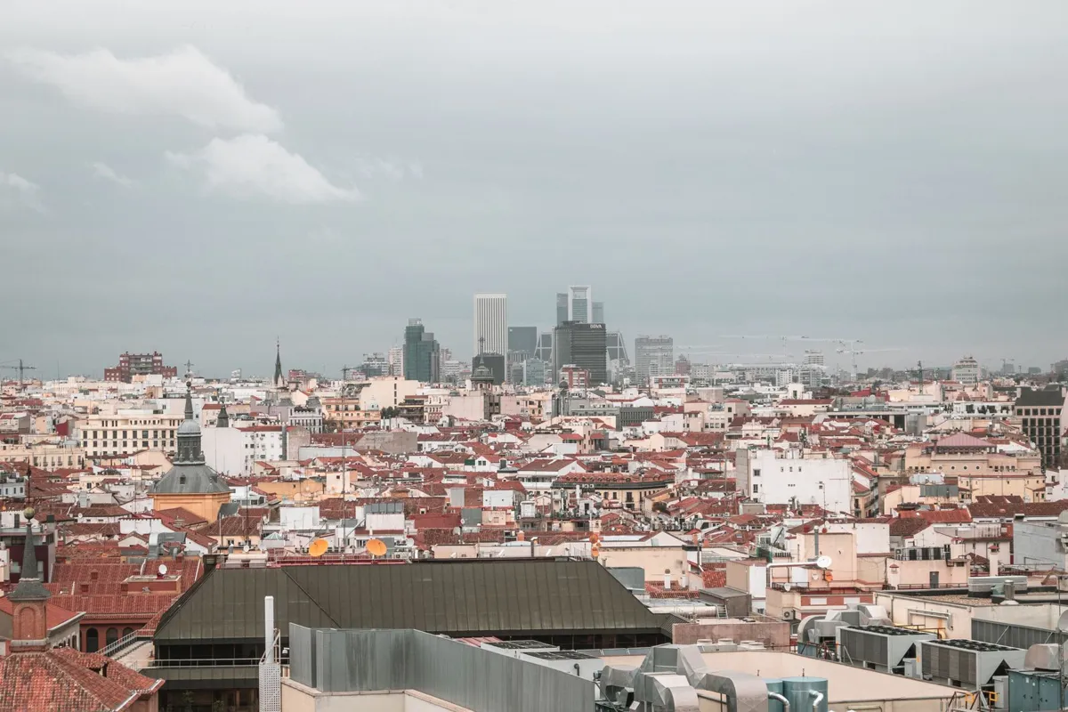 Madrid rooftops and skyline under cloudy skies