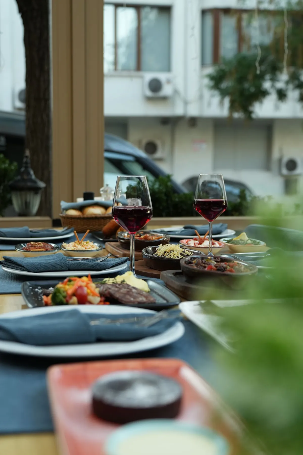 An outdoor restaurant meal with tapas